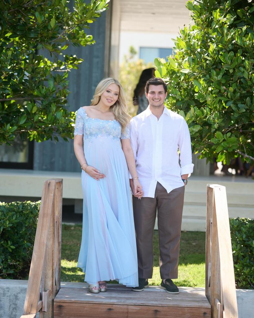 A pregnant Tiffany Trump and husband Michael Boulos pose for a photo at their baby shower on April 8, 2025.
