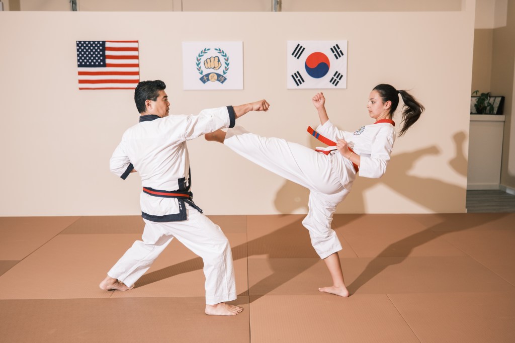 Willow DuBrovin works out with master instructor John Kim at Studio Moodo in Westhampton in Long Island.