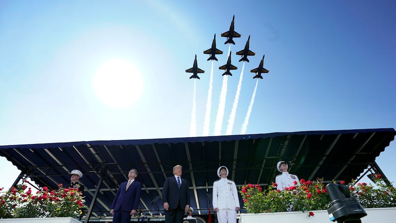 six jets from the Blue Angels perform a flyover Donald Trump watches during a  graduation ceremony at the U.S. Naval Academy in Annapolis, Maryland.