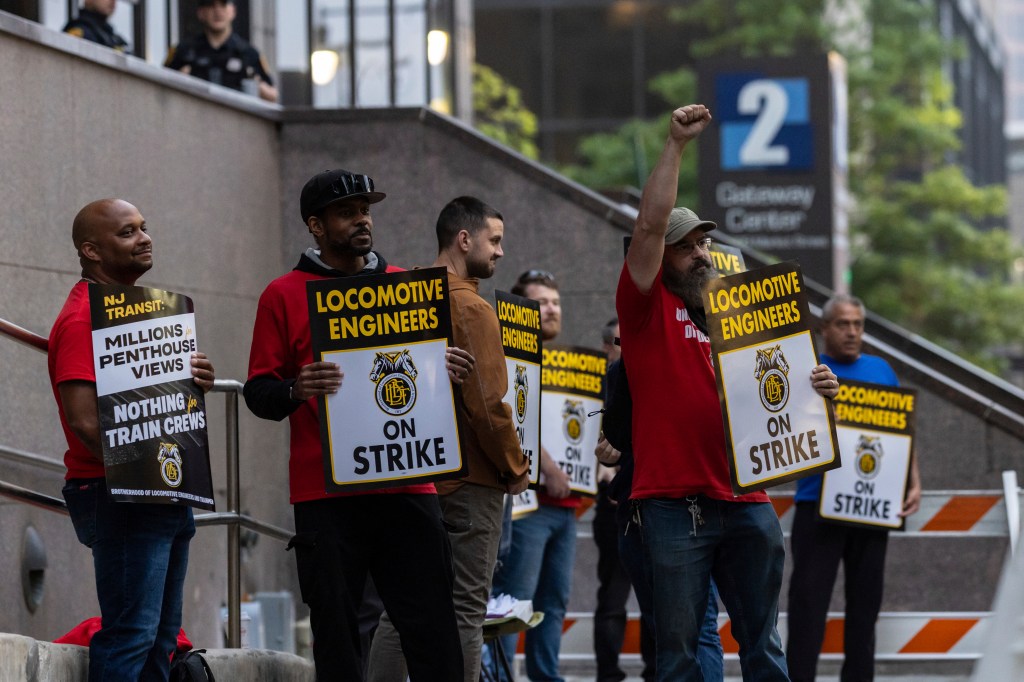 Union members from the Brotherhood of Locomotive Engineers and Trainmen form a picket line outside the NJ Transit Headquarters on May 16, 2025 in Newark, NJ. 