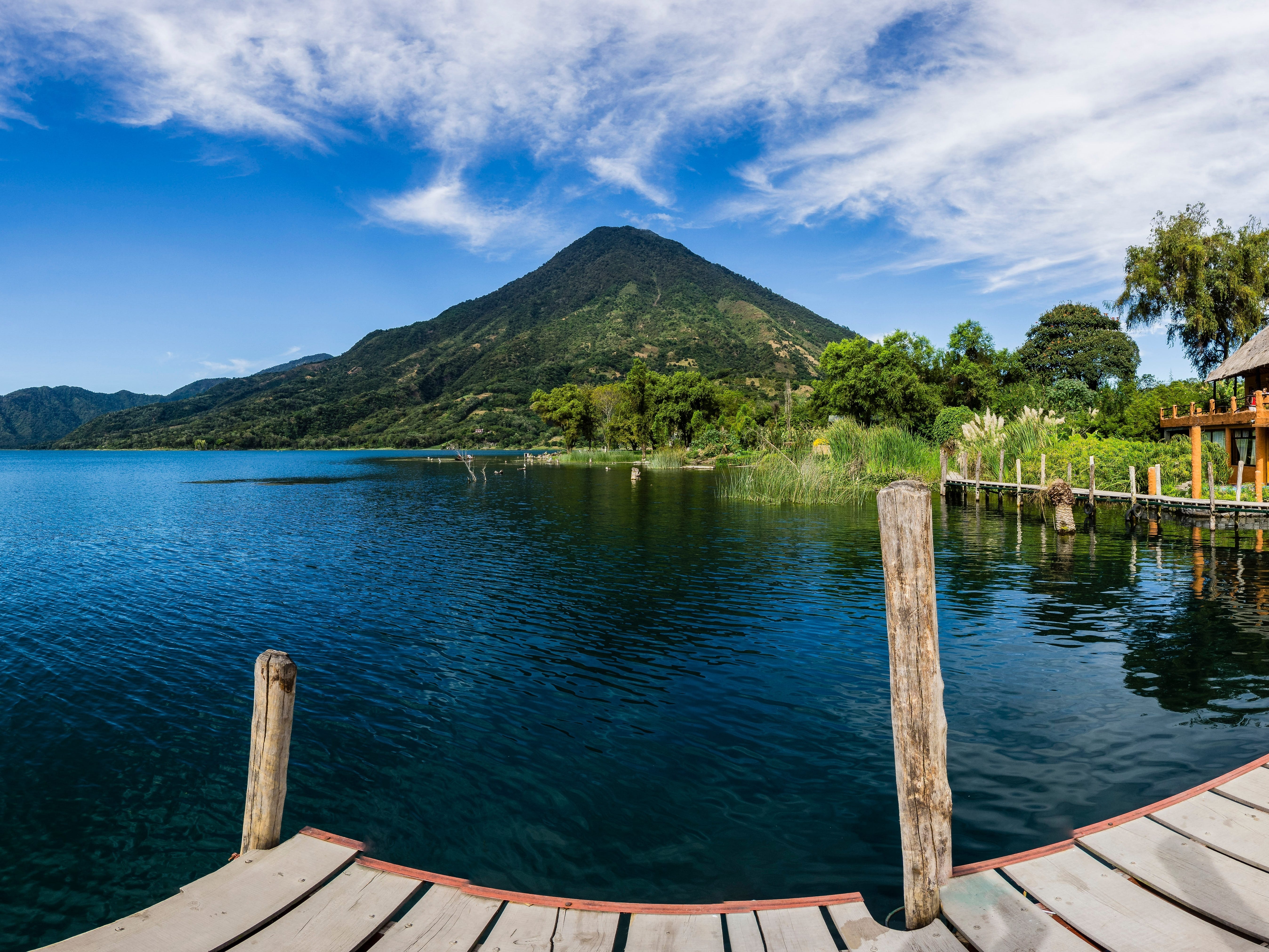 A wide-shot view of San Pedro volcano from a pier at Lake Atitlán.