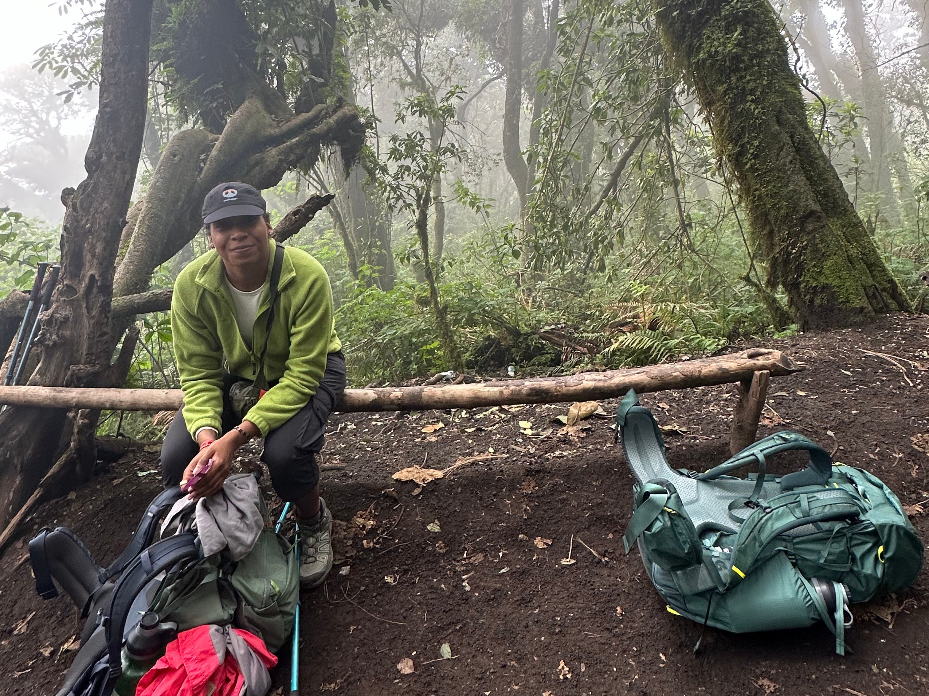 Photo of the author sitting on a bench during a hike up Acatenango in Guatemala.