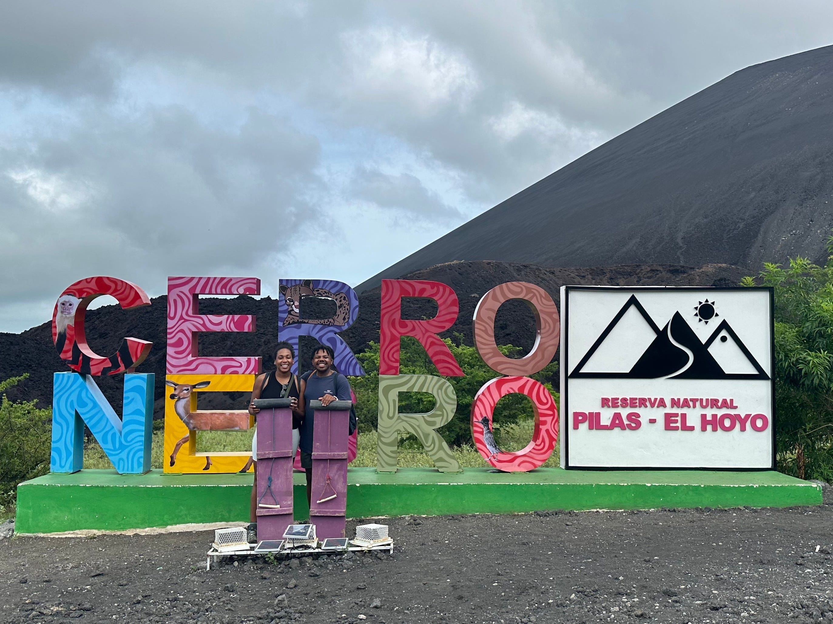 The author posing with a volcano board at Cerro Negro in Leon, Nicaragua.