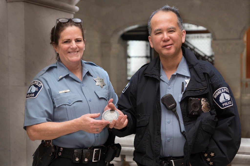 Minneapolis Police Department employees, Lt. Kim Lund and Ofc Elliot Wong, celebrating their 30-year anniversary in April 2017