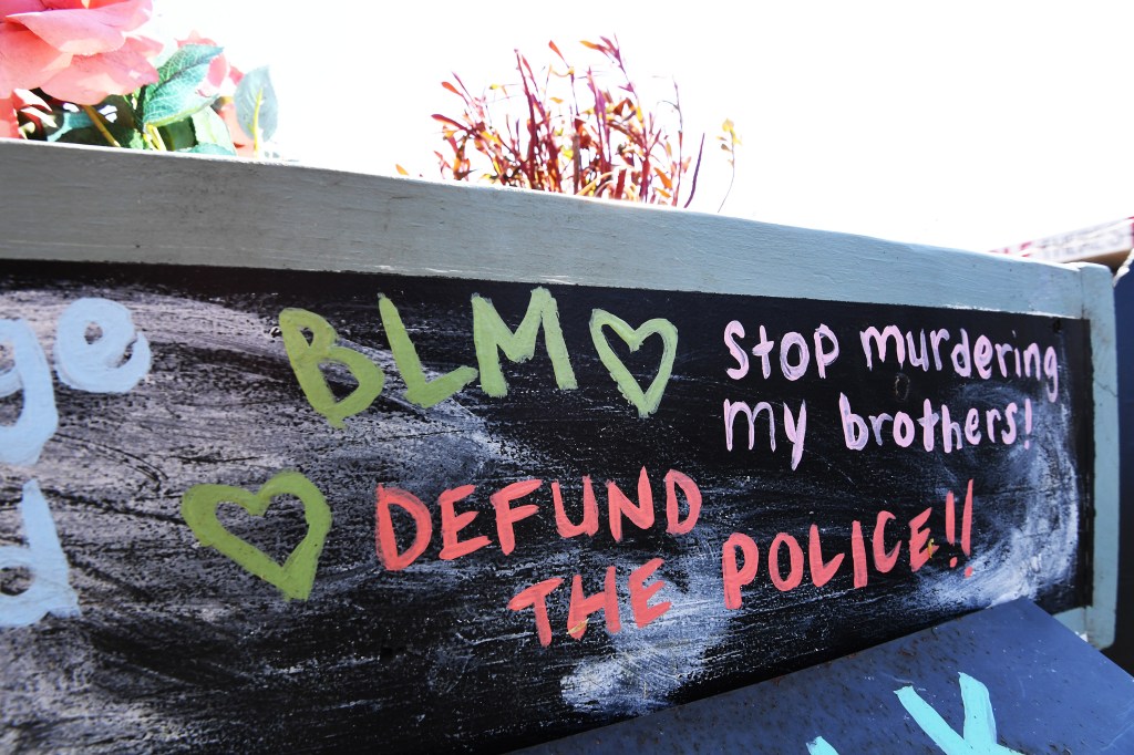 Signs advocating to defund the police in Minneapolis around George Floyd Square, five years after George Floyd's death