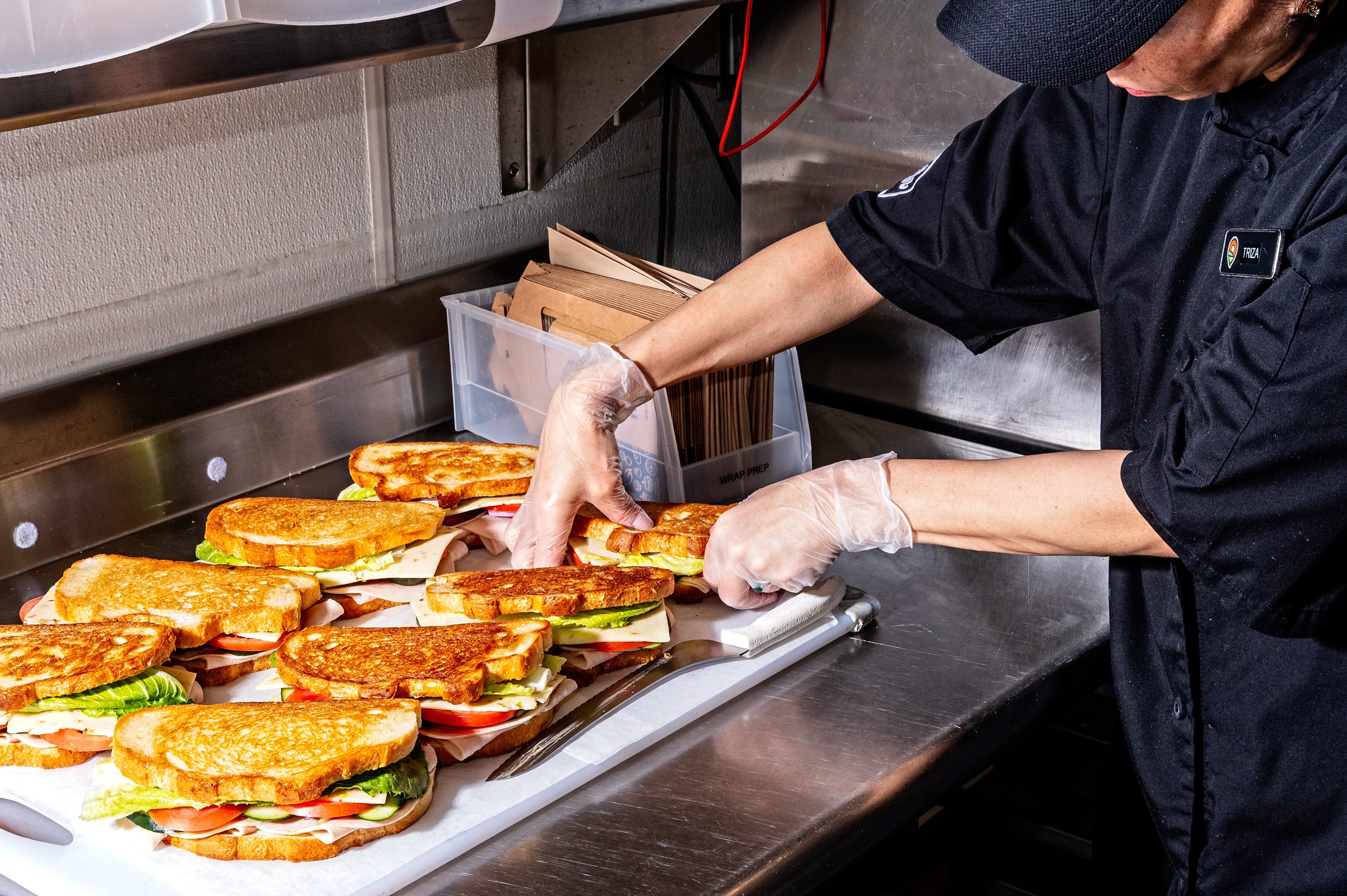 Dash In cook prepares sandwiches.