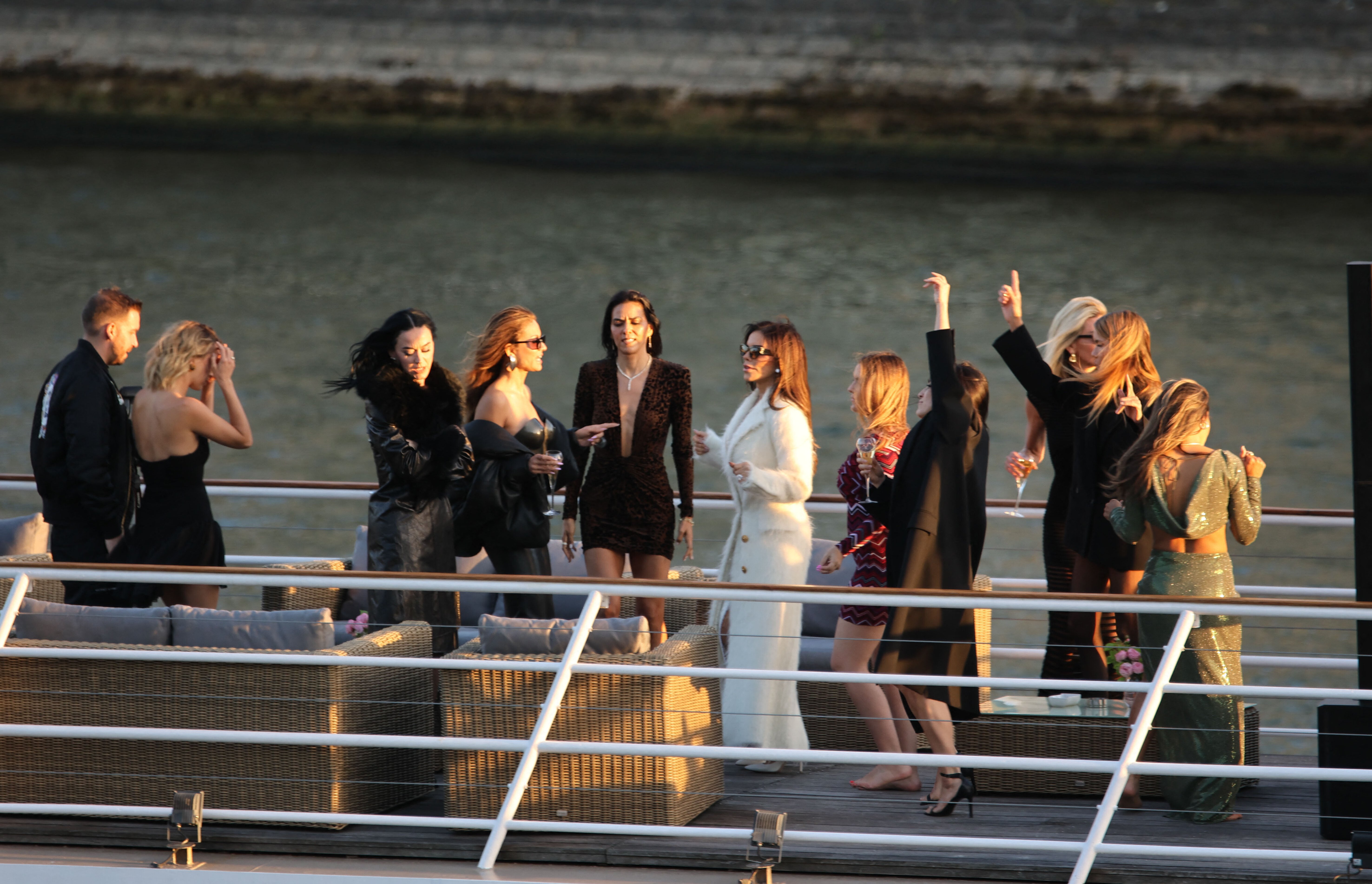 Lauren Sánchez dances on a boat with friends. 