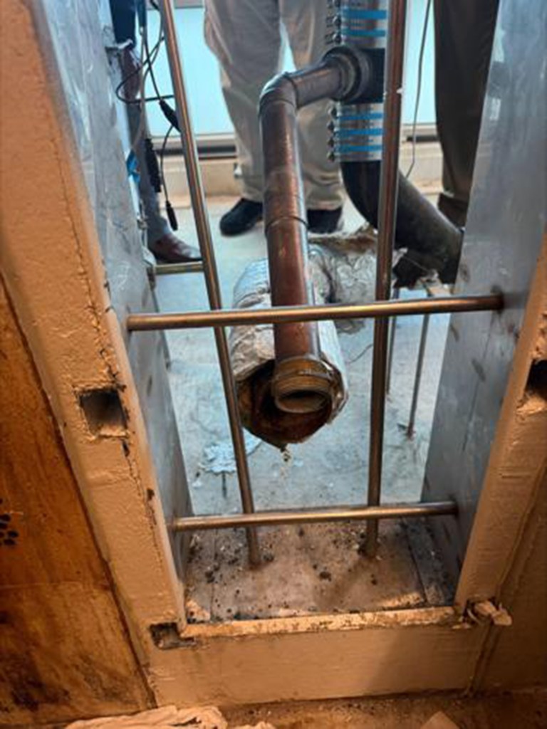 Officials said the panel behind the toilet could only be opened from the outside.