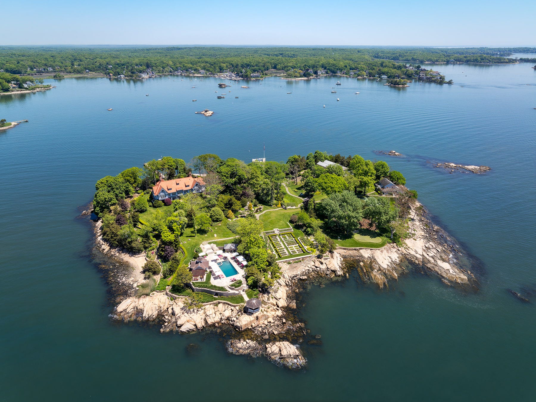 An aerial view of Rogers Island, with the house and pool visible.