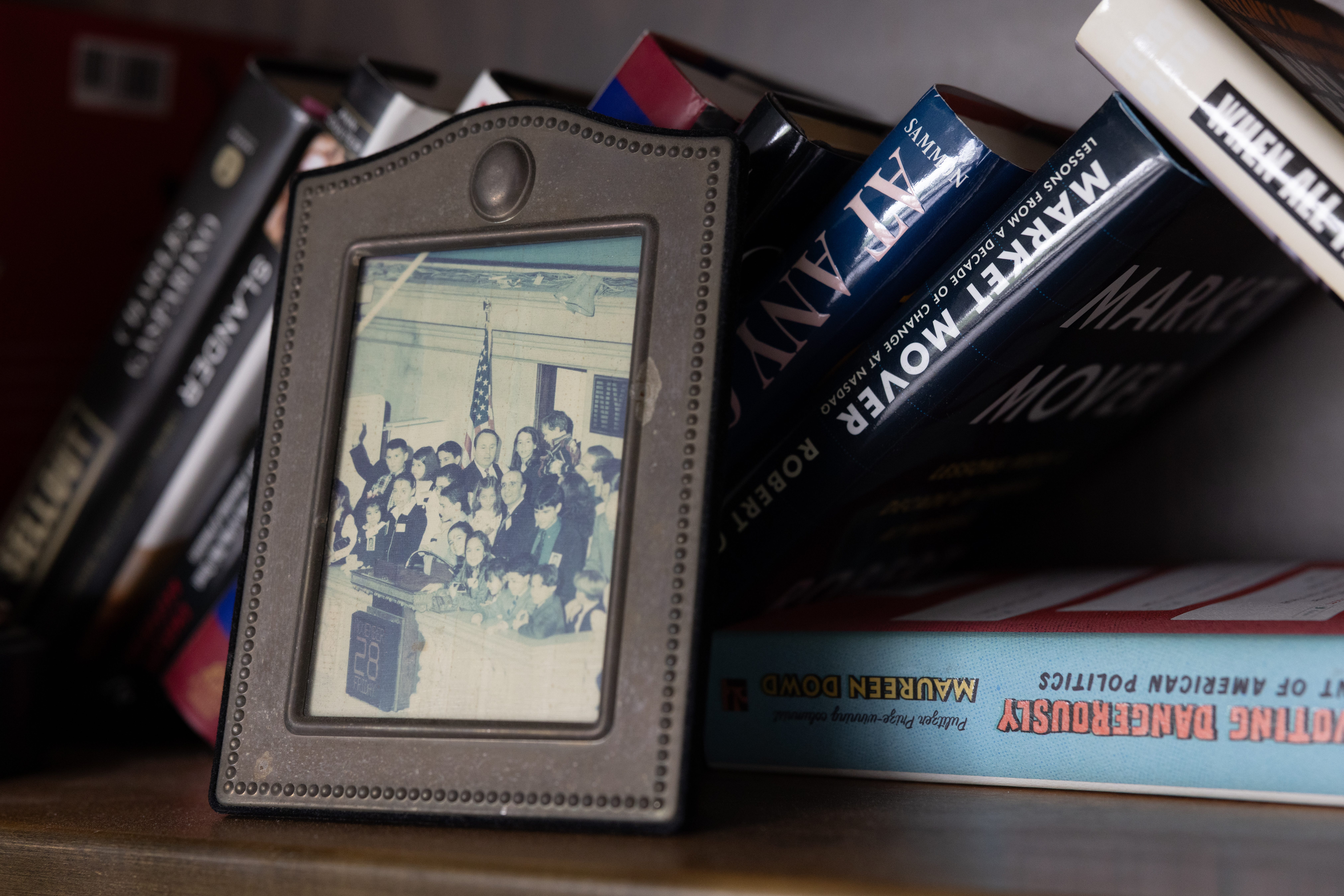 A photo of Pat Healy and Dick Grasso on a bookshelf