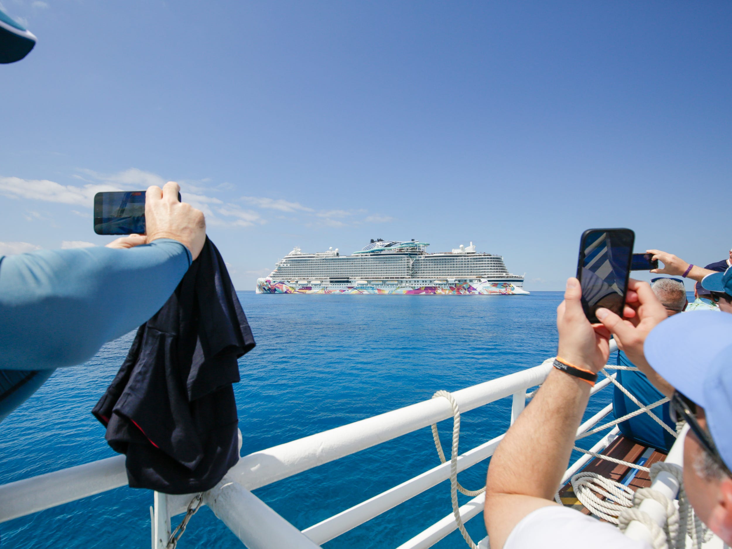 people taking photos of Norwegian Aqua