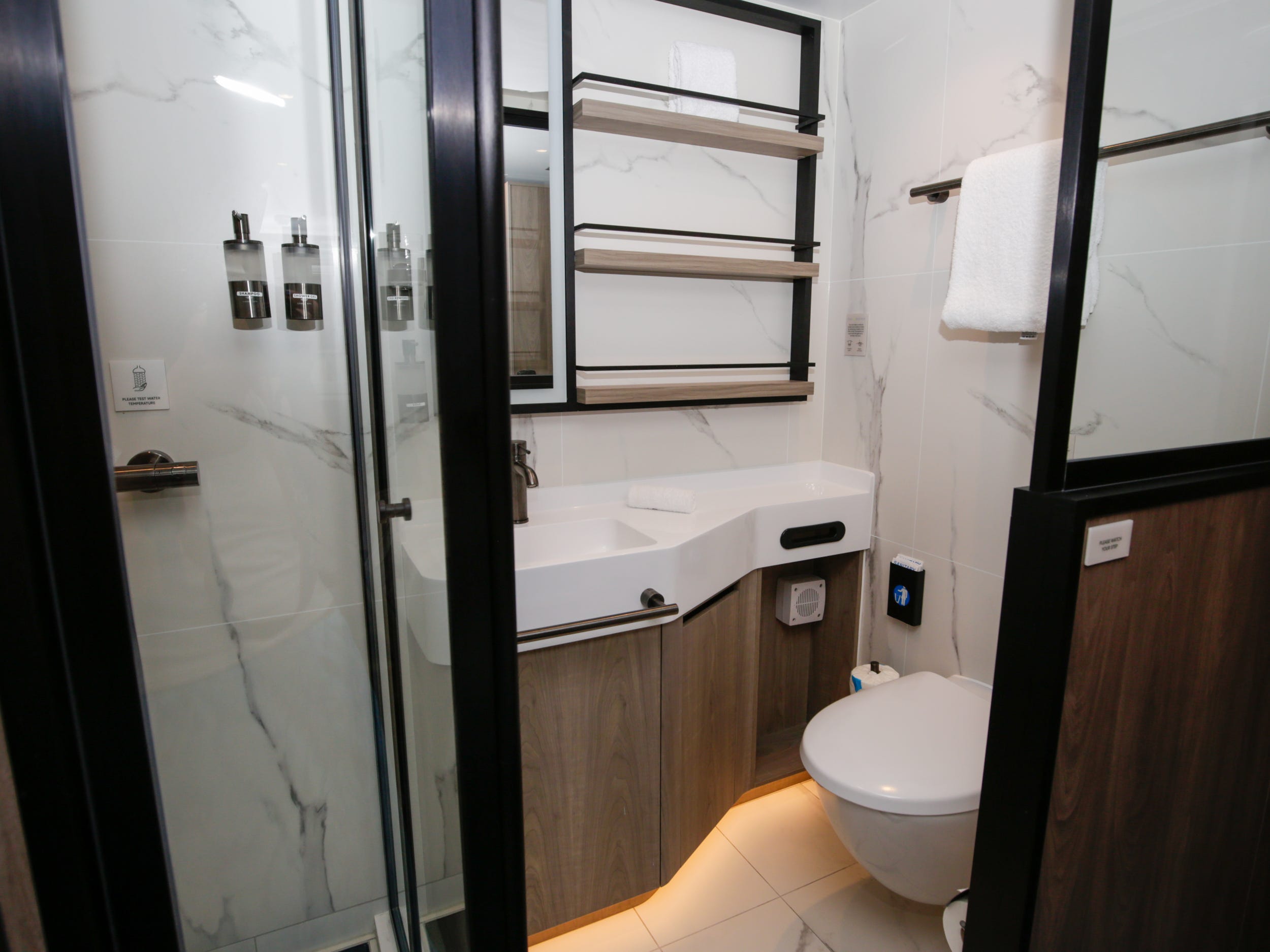 small, empty bathroom in a solo-person studio cabin on Norwegian Aqua