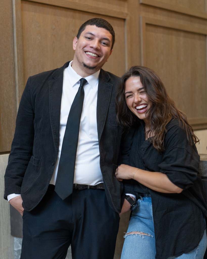 Abigail Olshavsky and Wilbey Martinez smiling in a friendly interaction in Brooklyn, NY
