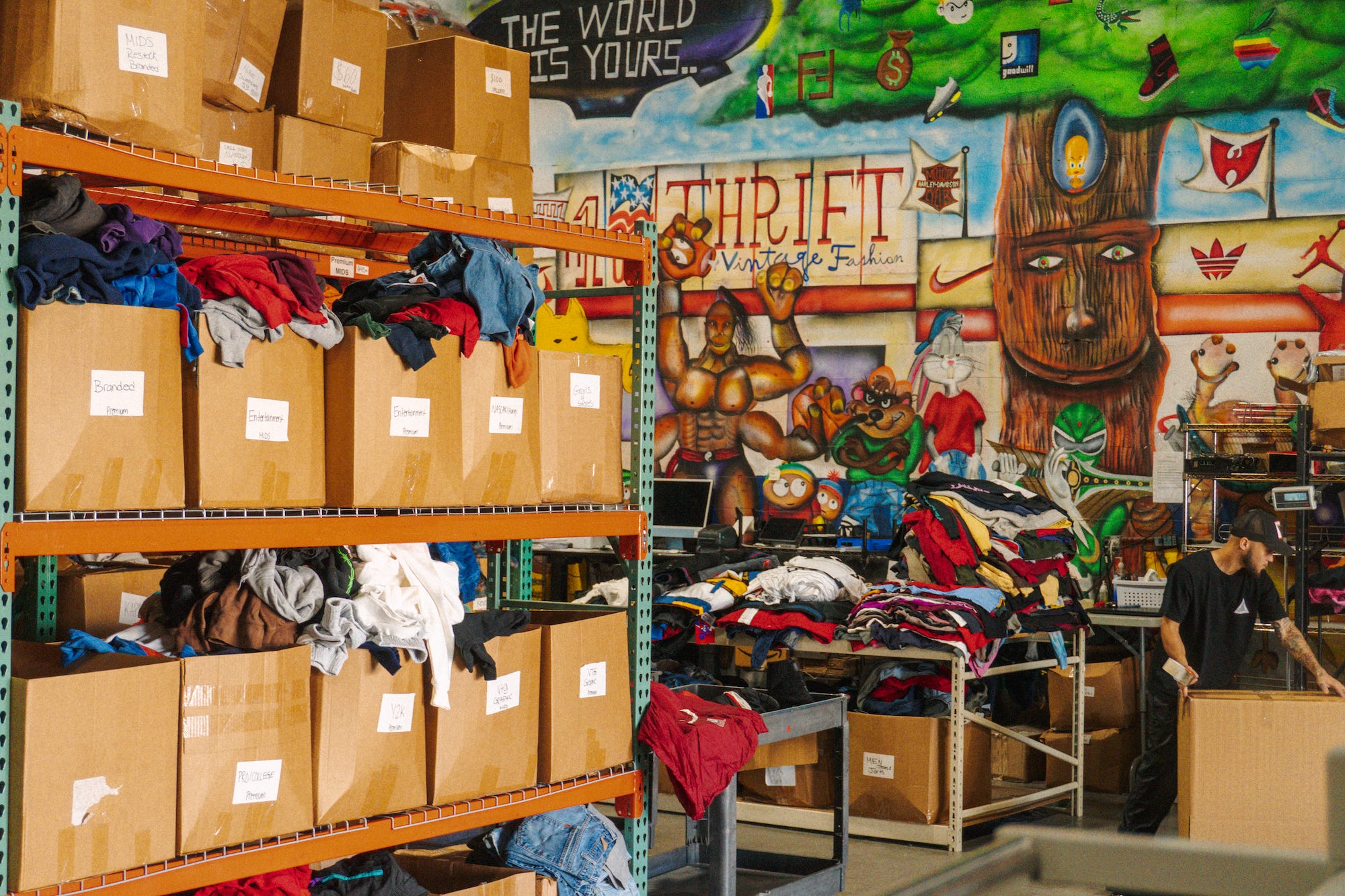 Boxes of clothing for resale at the Thrift Vintage Fashion warehouse.