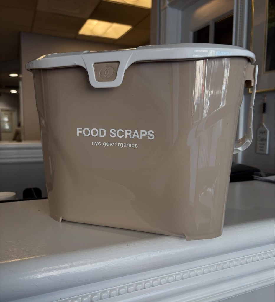 Countertop composting pail on a kitchen surface