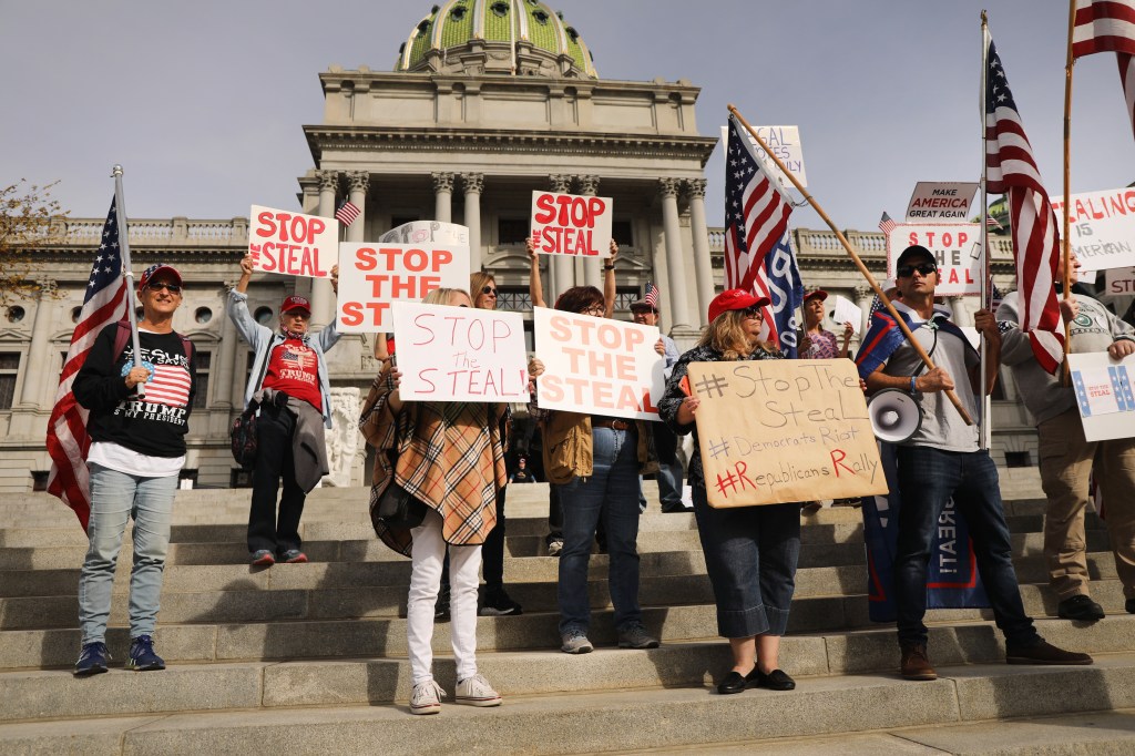 Dozens of people calling for stopping the vote count in Pennsylvania due to alleged fraud against President Donald Trump gather on the steps of the State Capital on November 05, 2020 in Harrisburg, Pennsylvania.