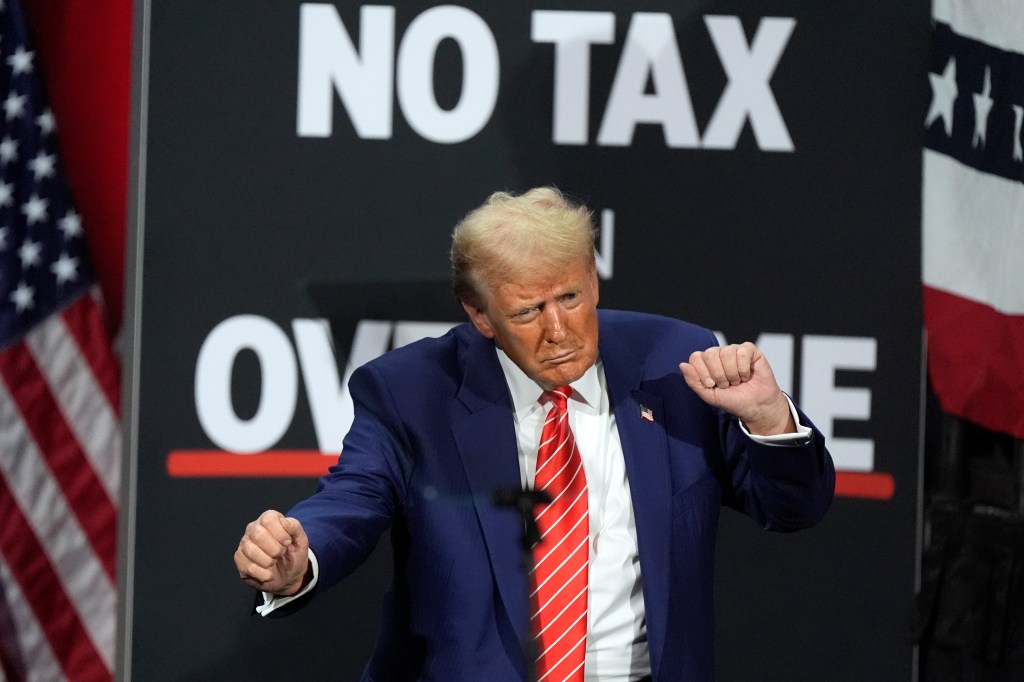 Republican presidential nominee former President Donald Trump dances at a campaign event at the Cobb Energy Performing Arts Centre, Oct. 15, 2024, in Atlanta. 