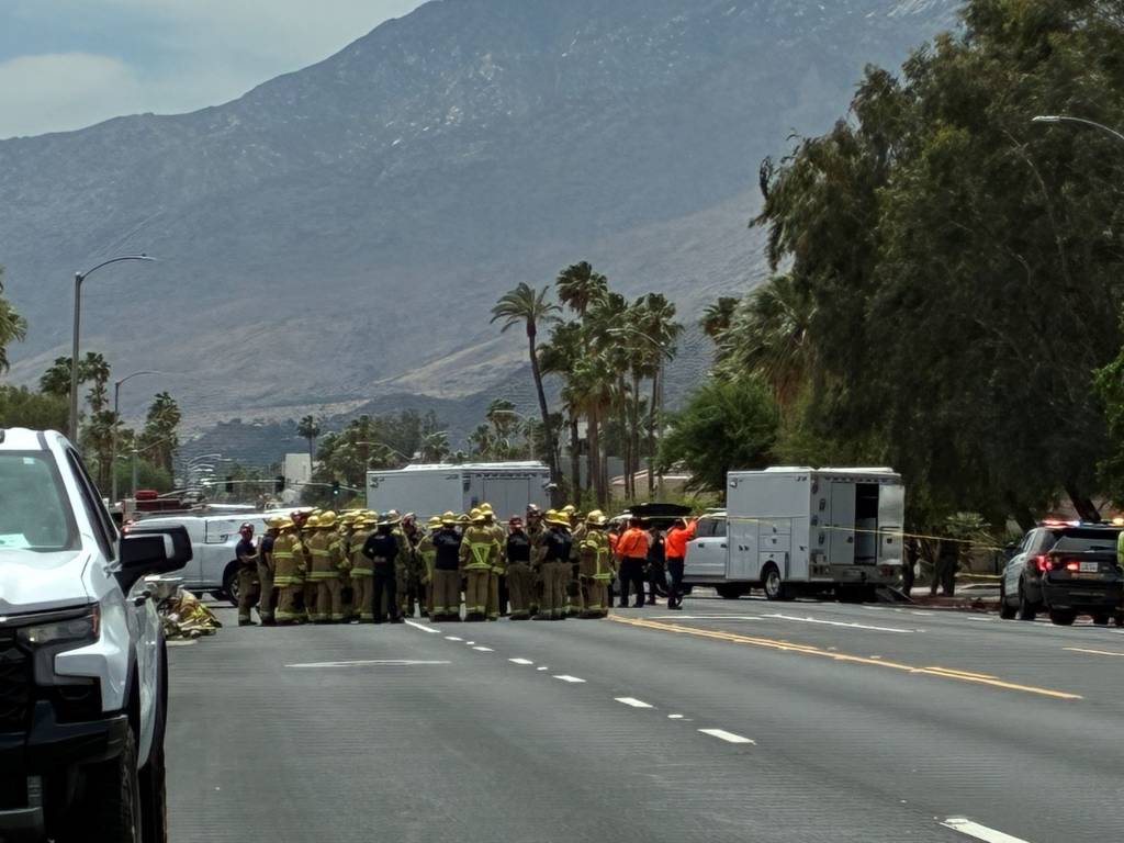 Authorities huddled near the scene of the explosion.