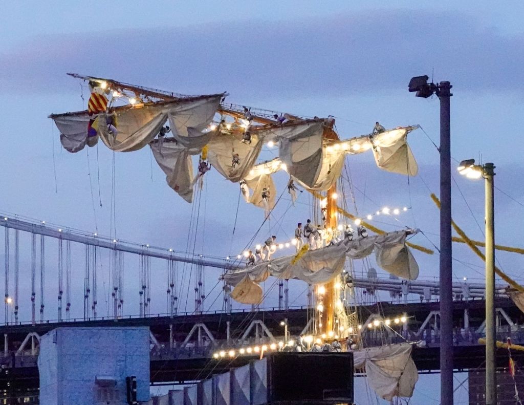 Sailors on the masts of the damaged Cuauhtemoc, a Mexican Navy training ship, after it hit the Brooklyn Bridge, sitting in the East River in New York, USA on 17 May 2025