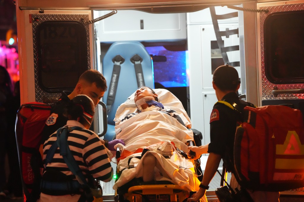 An injured crew member is placed in the back of an ambulance after being rescued from the damaged vessel on May 17, 2025.