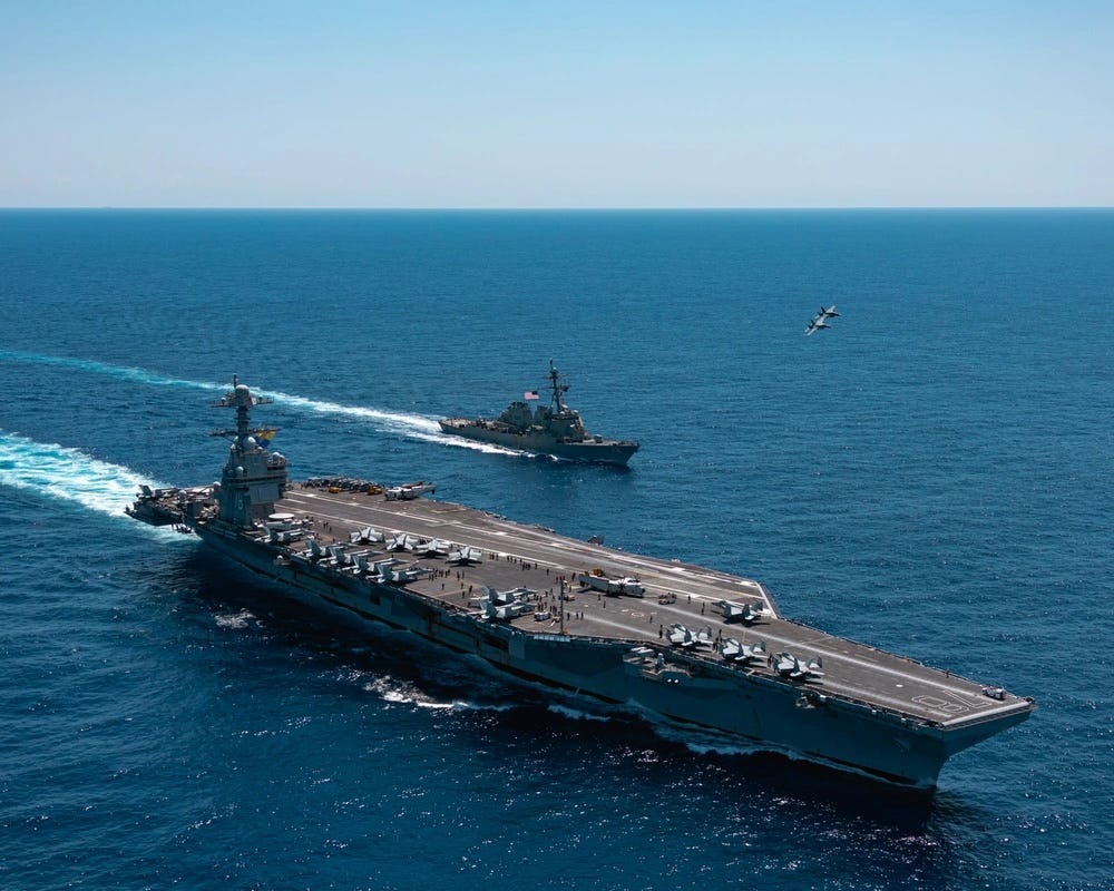 USS Gerald R. Ford sails near the Arleigh Burke-class guided-missile destroyer USS Mahan.