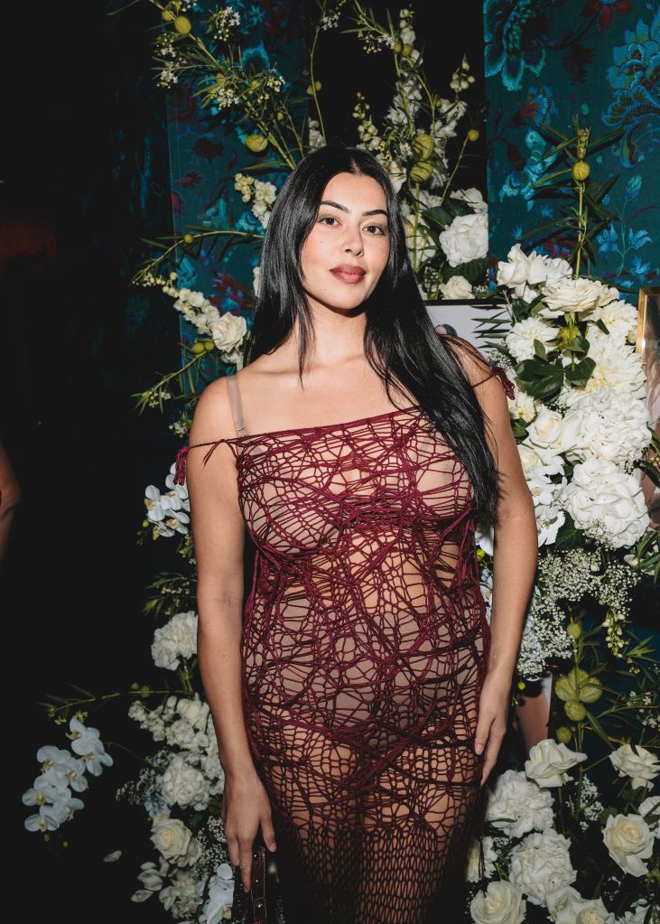 Lauren Chan in a maroon dress.