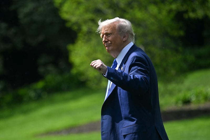 US President Donald Trump gestures as he walks to Marine One on South Lawn of the White House in Washington, DC, on May 12, 2025. President Trump is travelling to the Middle East, where Saudi Arabia will be the first stop on a four-day trip. (Photo by Jim WATSON / AFP) (Photo by JIM WATSON/AFP via Getty Images)