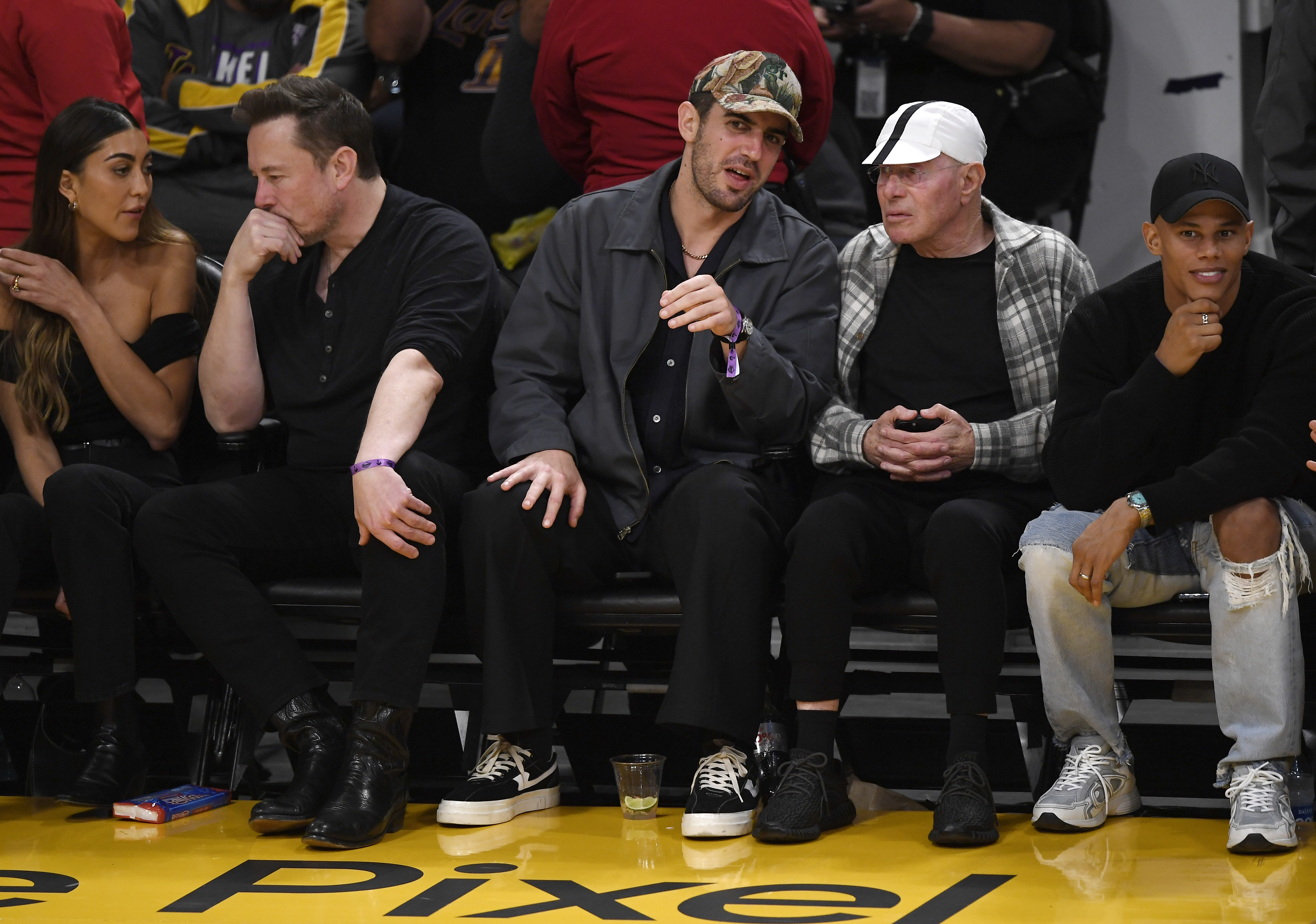 Elon Musk, David Geffen and David Armstrong at NBA game in 2023