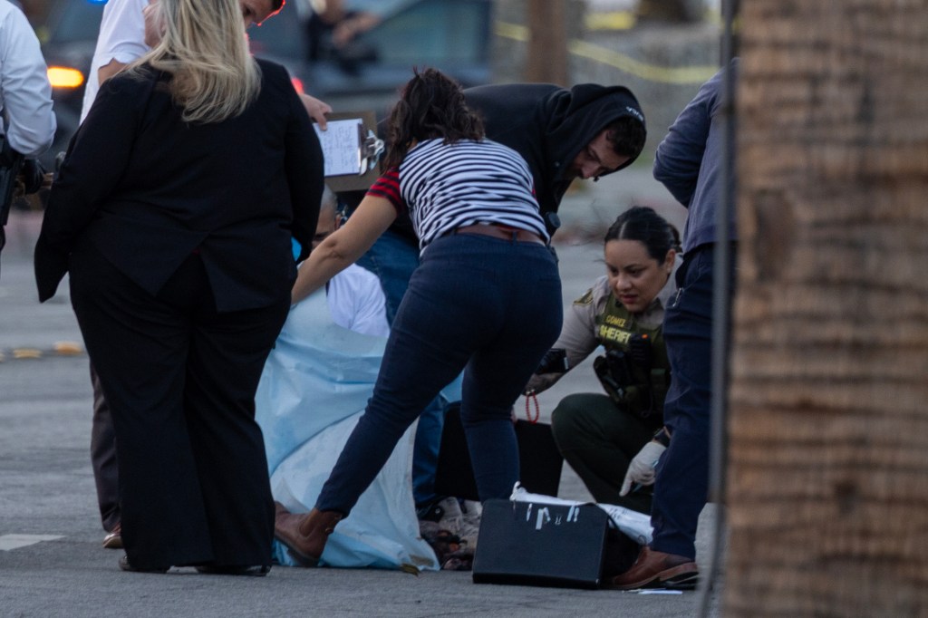 Investigators look at possible evidence near the American Reproductive Centers fertility clinic following a bomb blast.