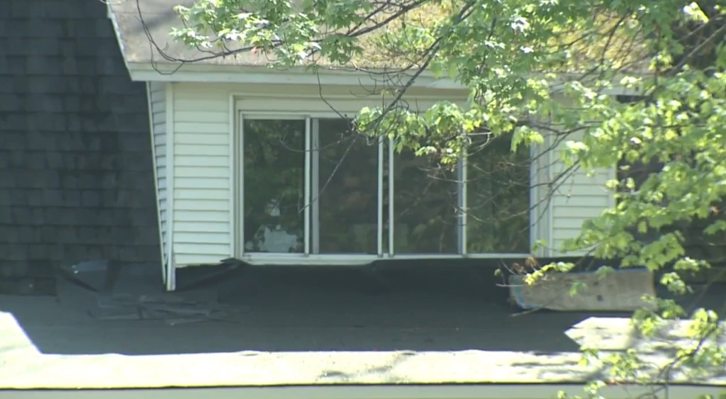 Officials say a 20-year-old suspected gunman unloaded several rounds from his own gun into the floorboards as 10-20 people were partying inside.