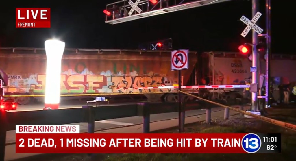 A train stands still at a crossing after striking a family in Freemont, Ohio on May 18, 2025.