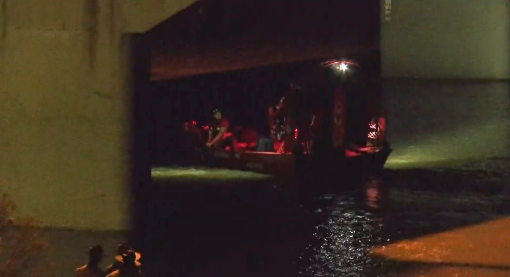 First responders search the waterways looking for a missing child after the incident.