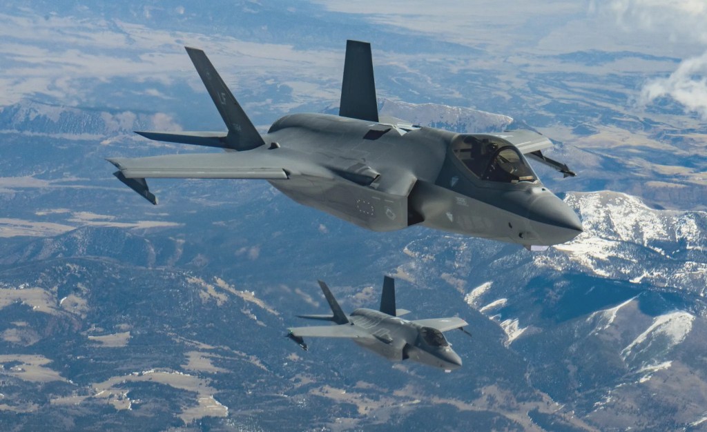 Two F-35A Joint Strike Fighters assigned to the US Air Force's 56th Fighter Wing in flight.