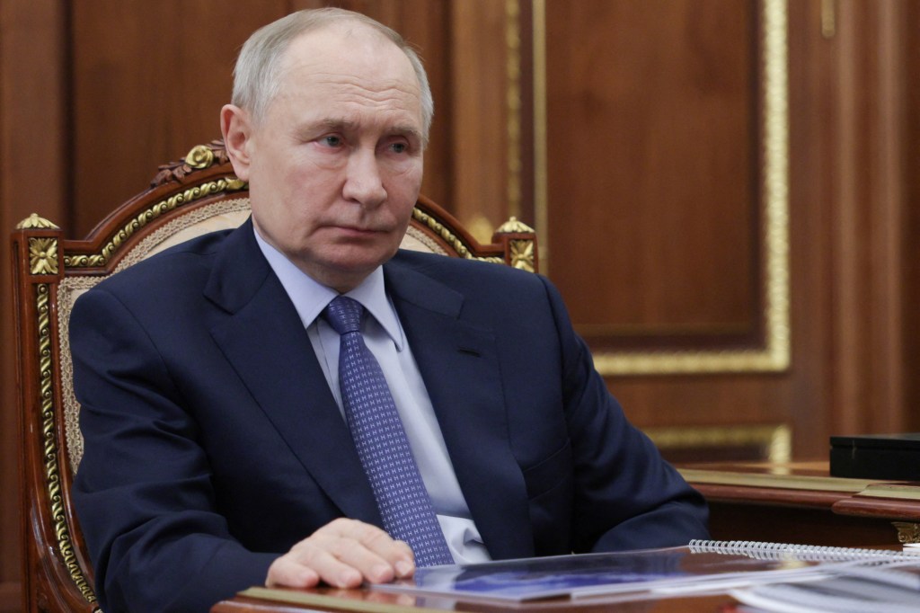 Russian President Vladimir Putin sits in on a meeting at the Kremlin in Moscow on May 15, 2025.