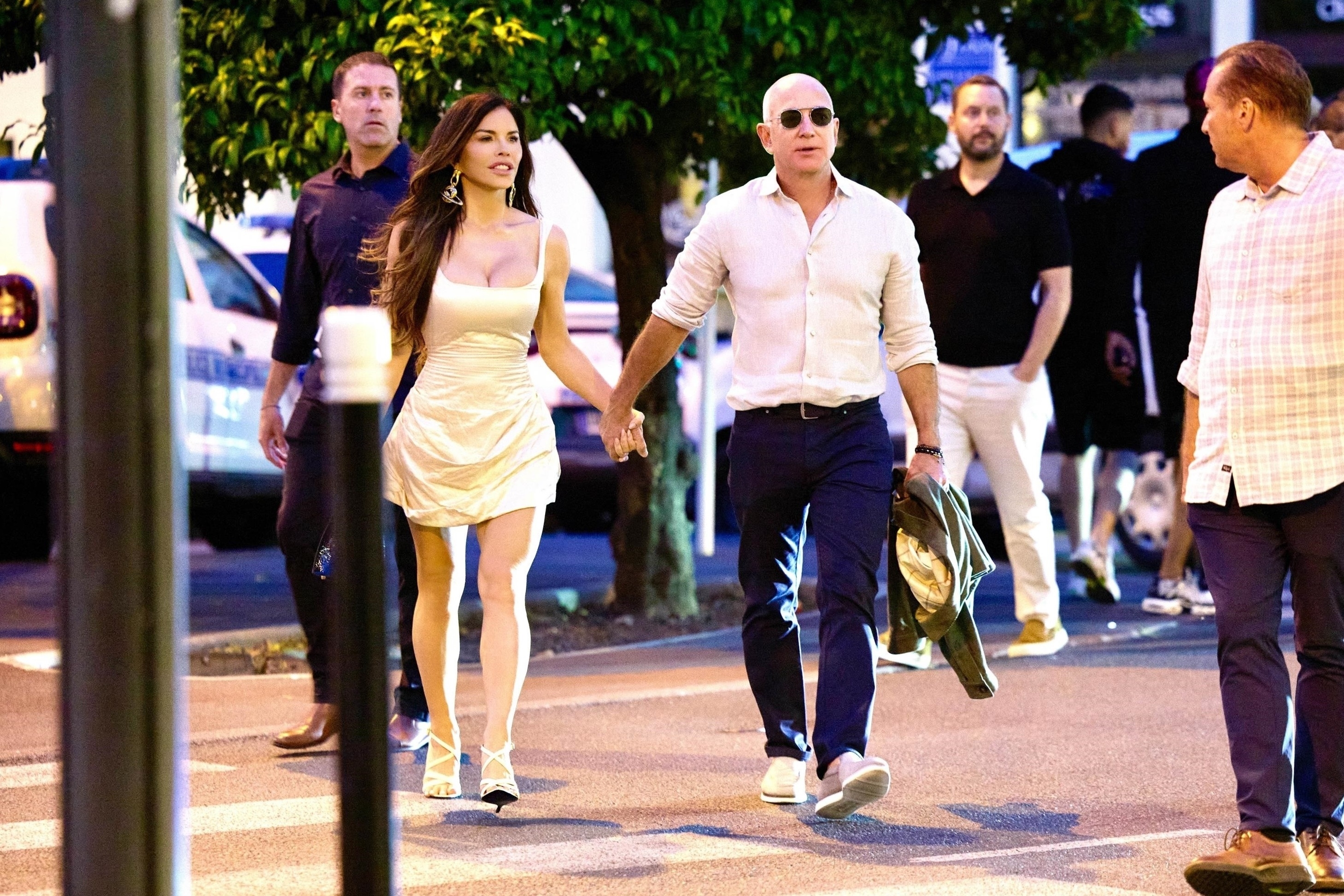 Jeff Bezos and Lauren Sánchez holding hands in cannes