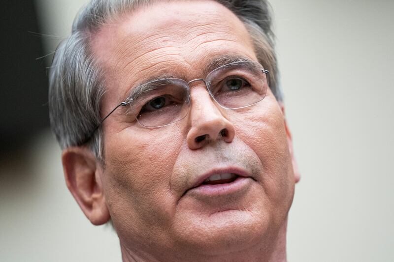 Close-up of Treasury Secretary Scott Bessent testifies appearing at a House committee hearing.