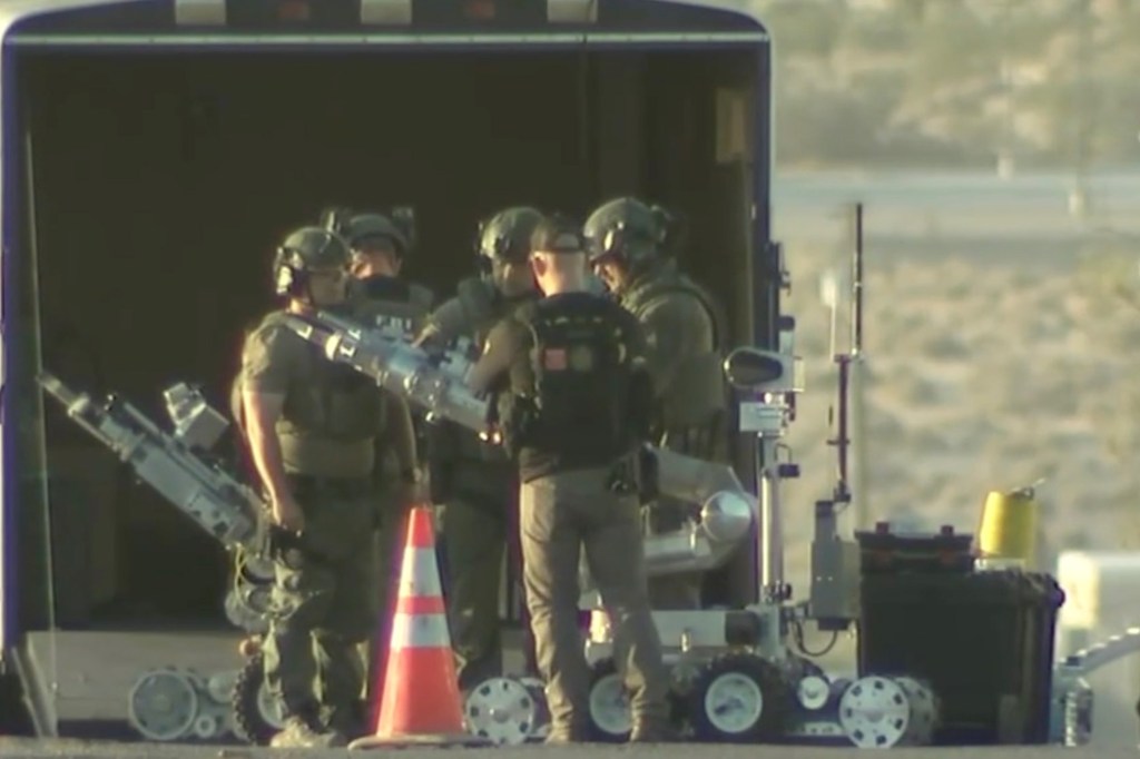 Tactical teams, armored vehicles, including bomb squad units in full gear, surrounded Bartkus' house.