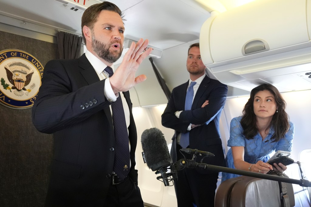 Vice President JD Vance talks to reporters on board Air Force Two at Leonardo da Vinci International Airport, in Rome, Monday, May 19, 2025.