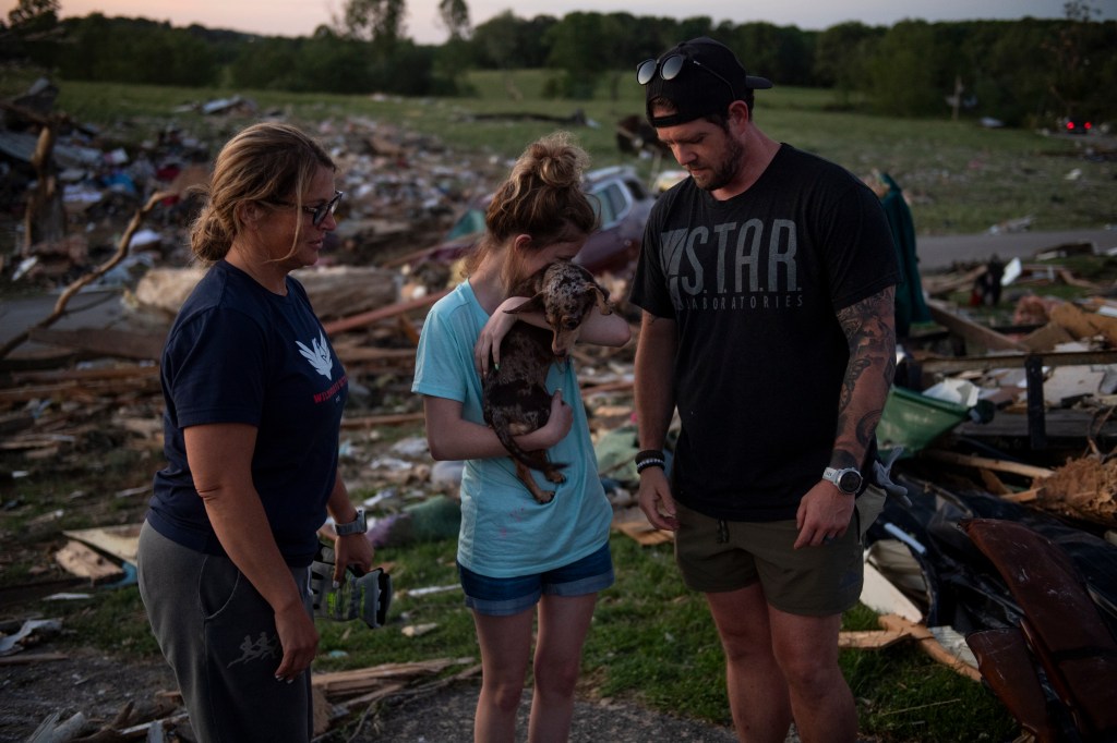 13-year-old Payson Sexton being reunited with her dog after a tornado, in London, Kentucky on May 17, 2025