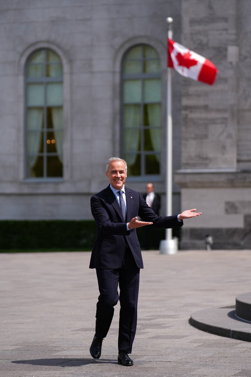 Canadian Prime Minister Mark Carney speaks to the media after the swearing-in ceremony of the new cabinet at Rideau Hall in Ottawa on May 13, 2025.