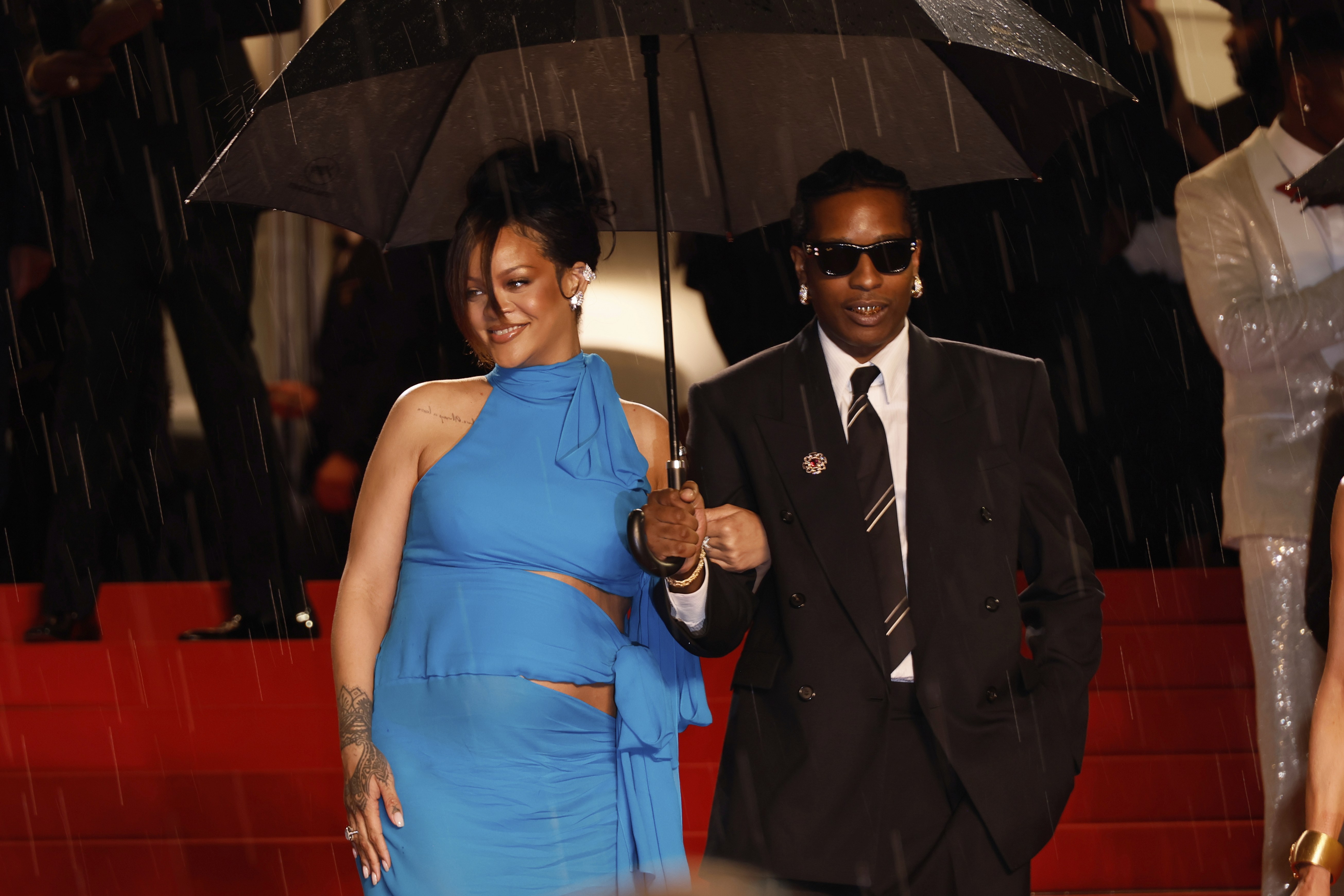 ASAP Rocky and Rihanna with an umbrella. 