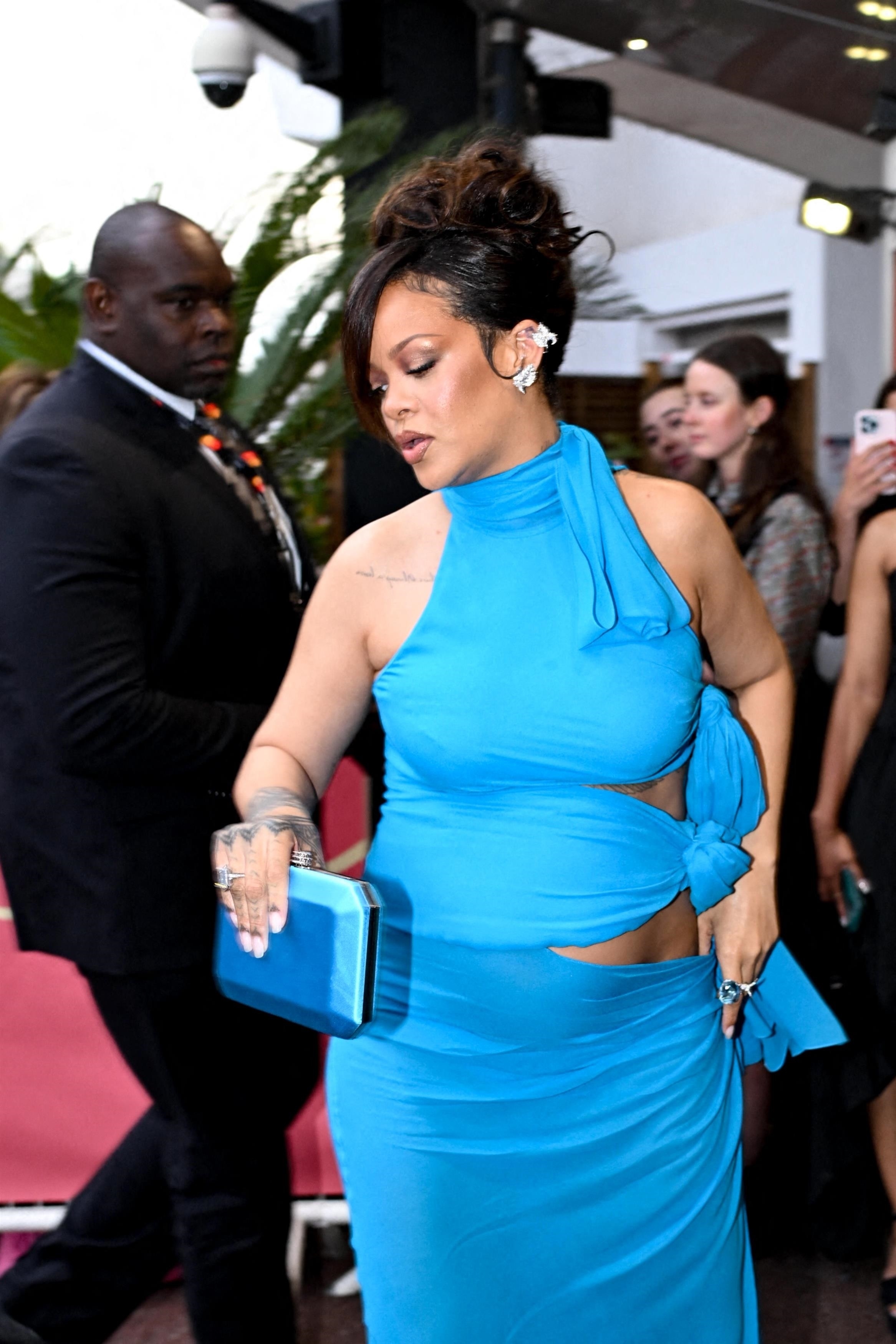 Rihanna in a blue scarf dress. 