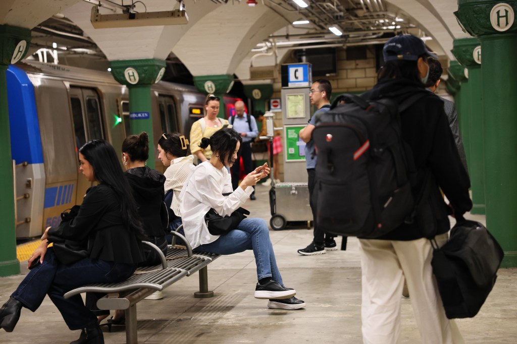People waiting for a PATH train at the Hoboken station, New Jersey, after the end of a NJ Transit train strike on May 19, 2025, including Giada Colagrande, Tamara Radočaj, and Christian Nesmith.