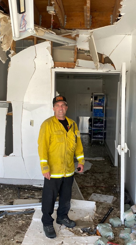 A firefighter inside a ruined building of American Reproductive Clinics.