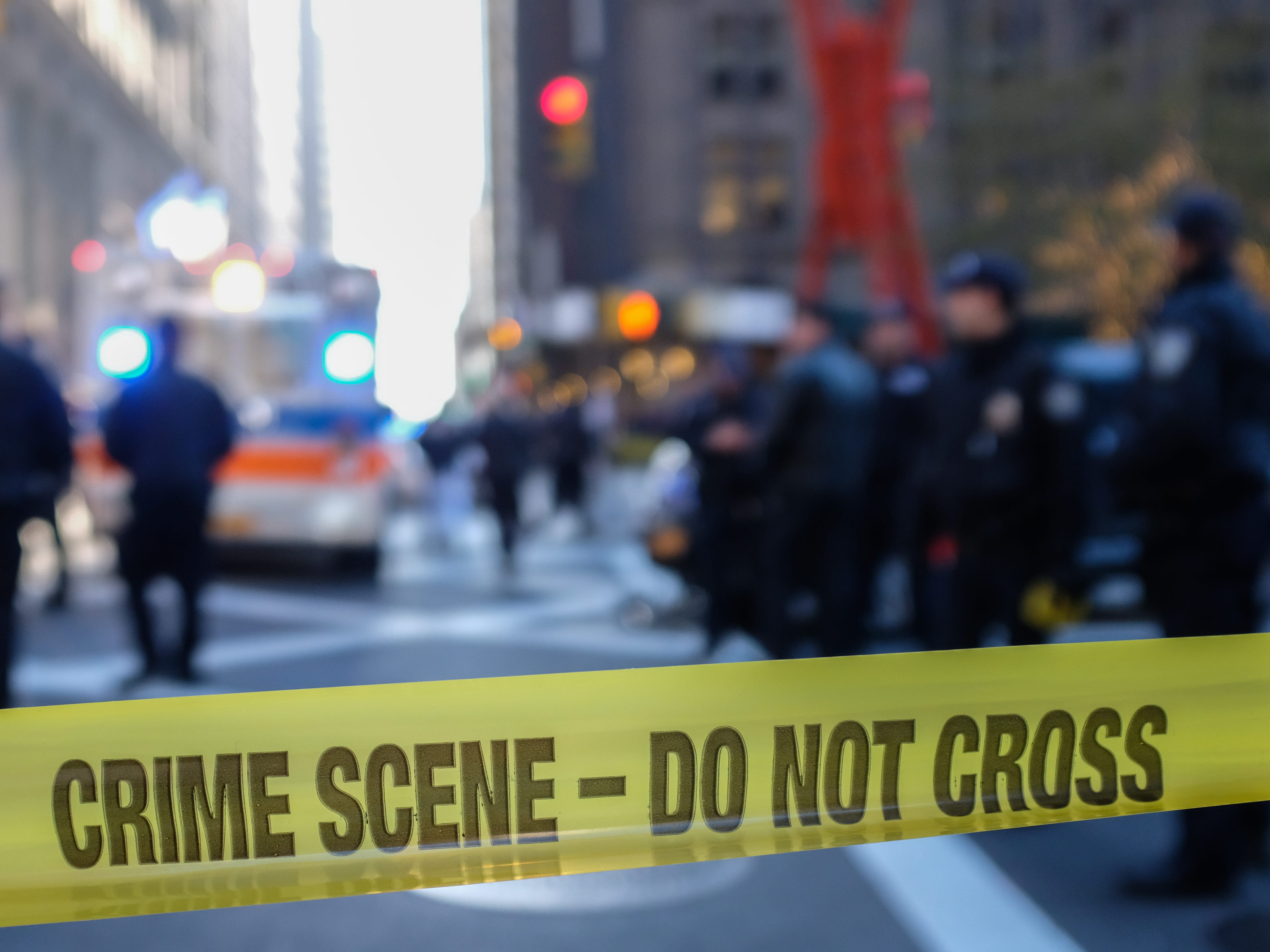Yellow tape that says "Crime scene - do not cross"