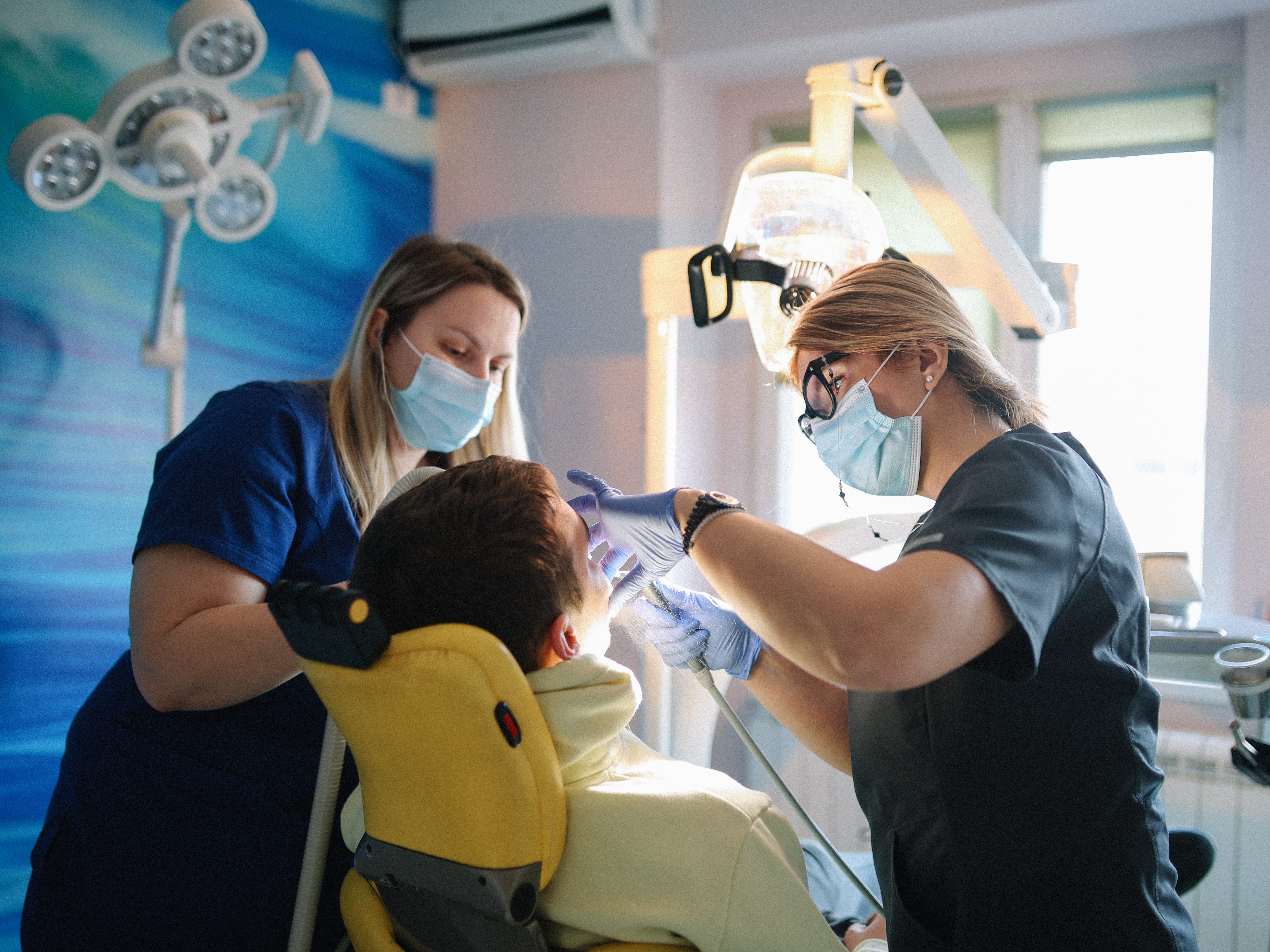 Dentists with a patient