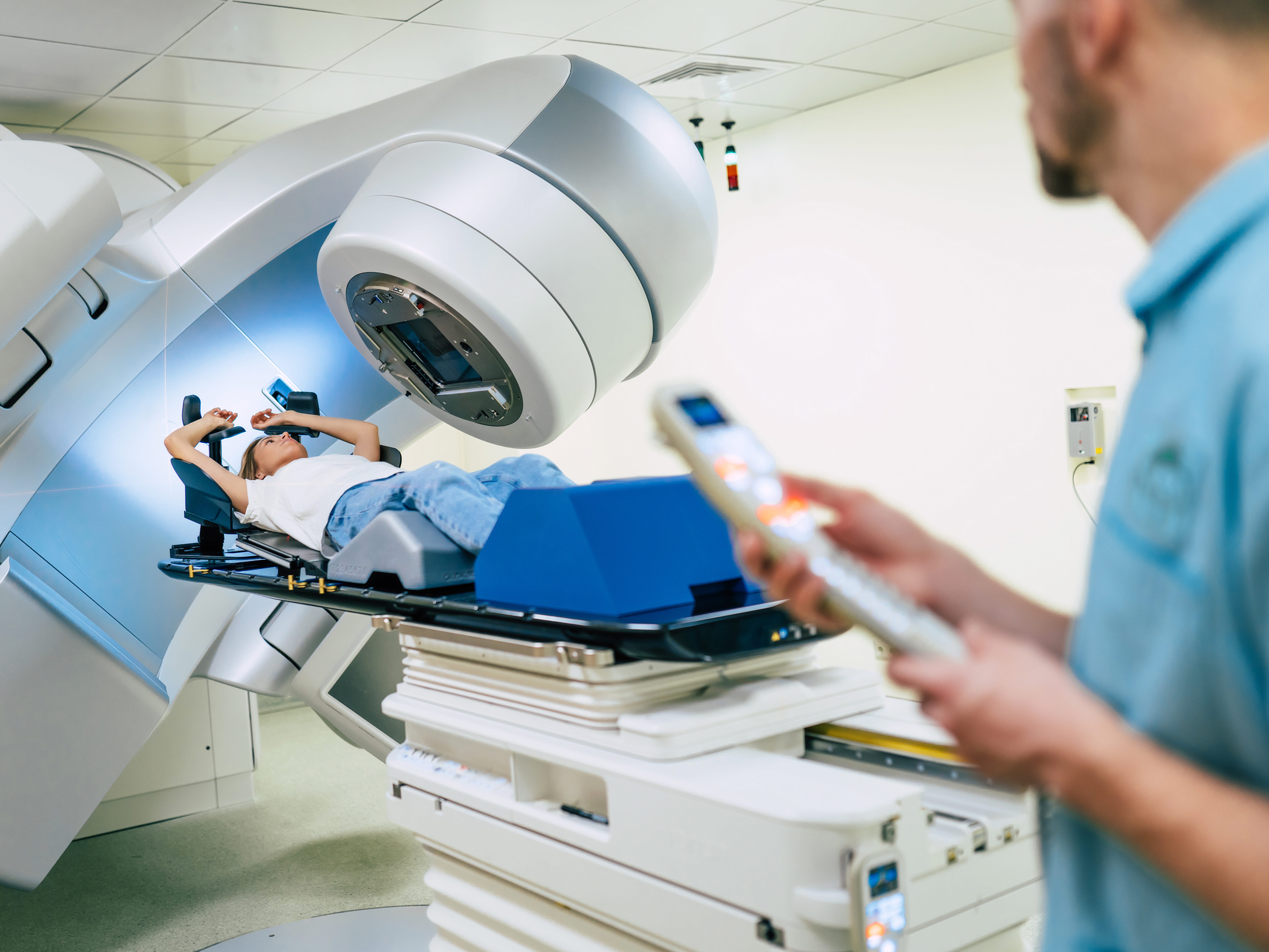 Healthcare worker, patient, and a linear accelerator