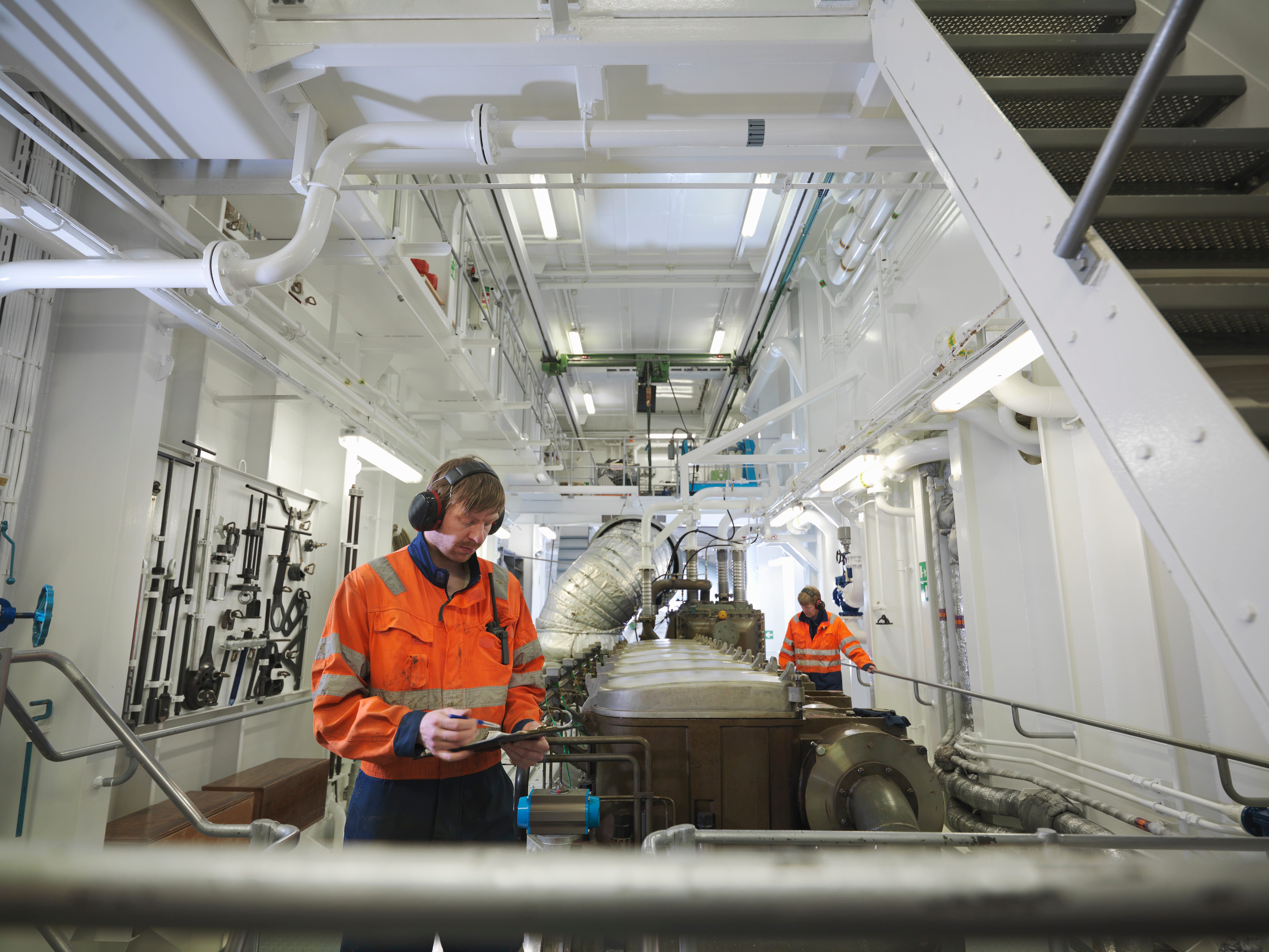Workers in ship's engine room