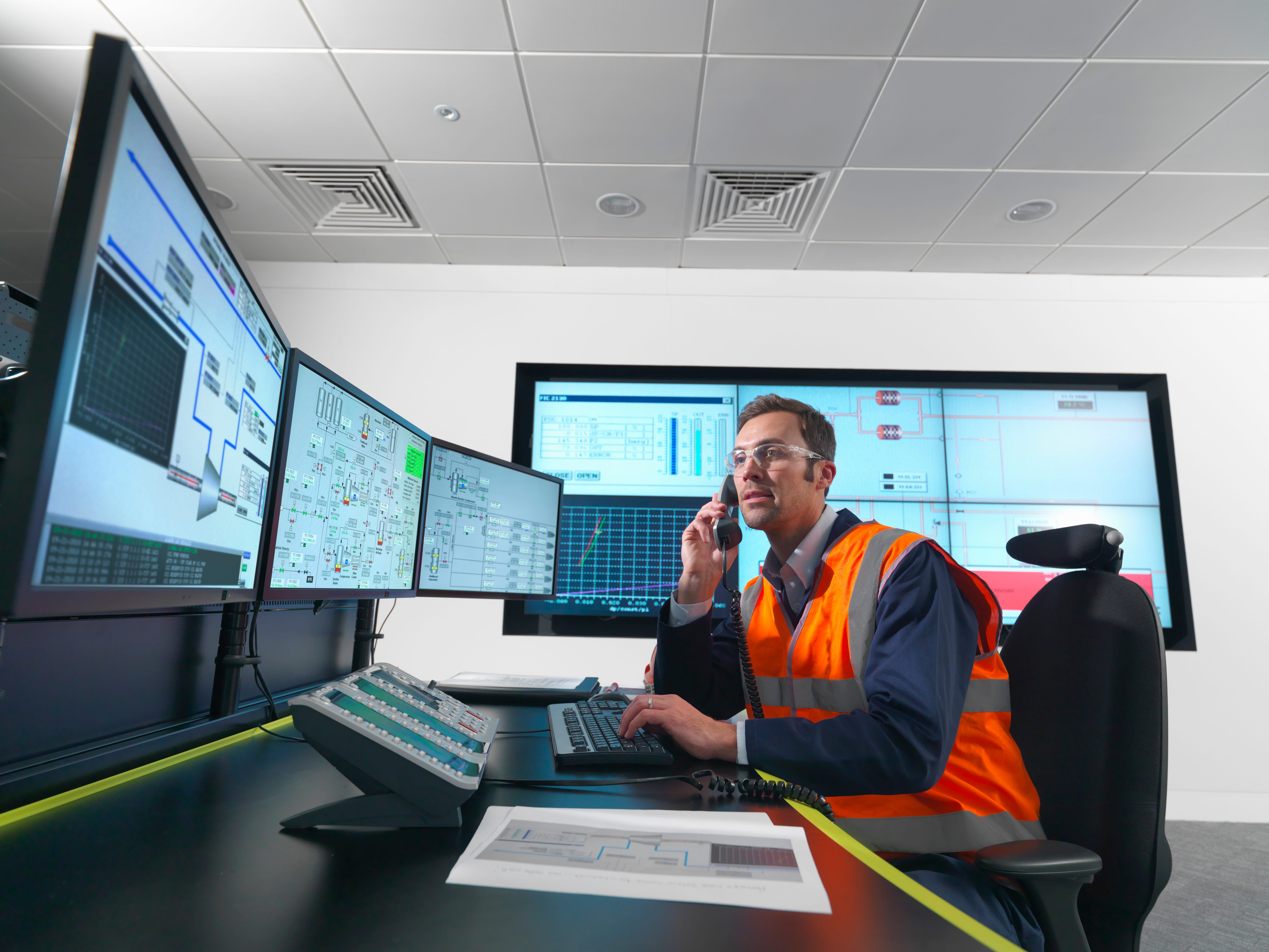Worker and computer screens