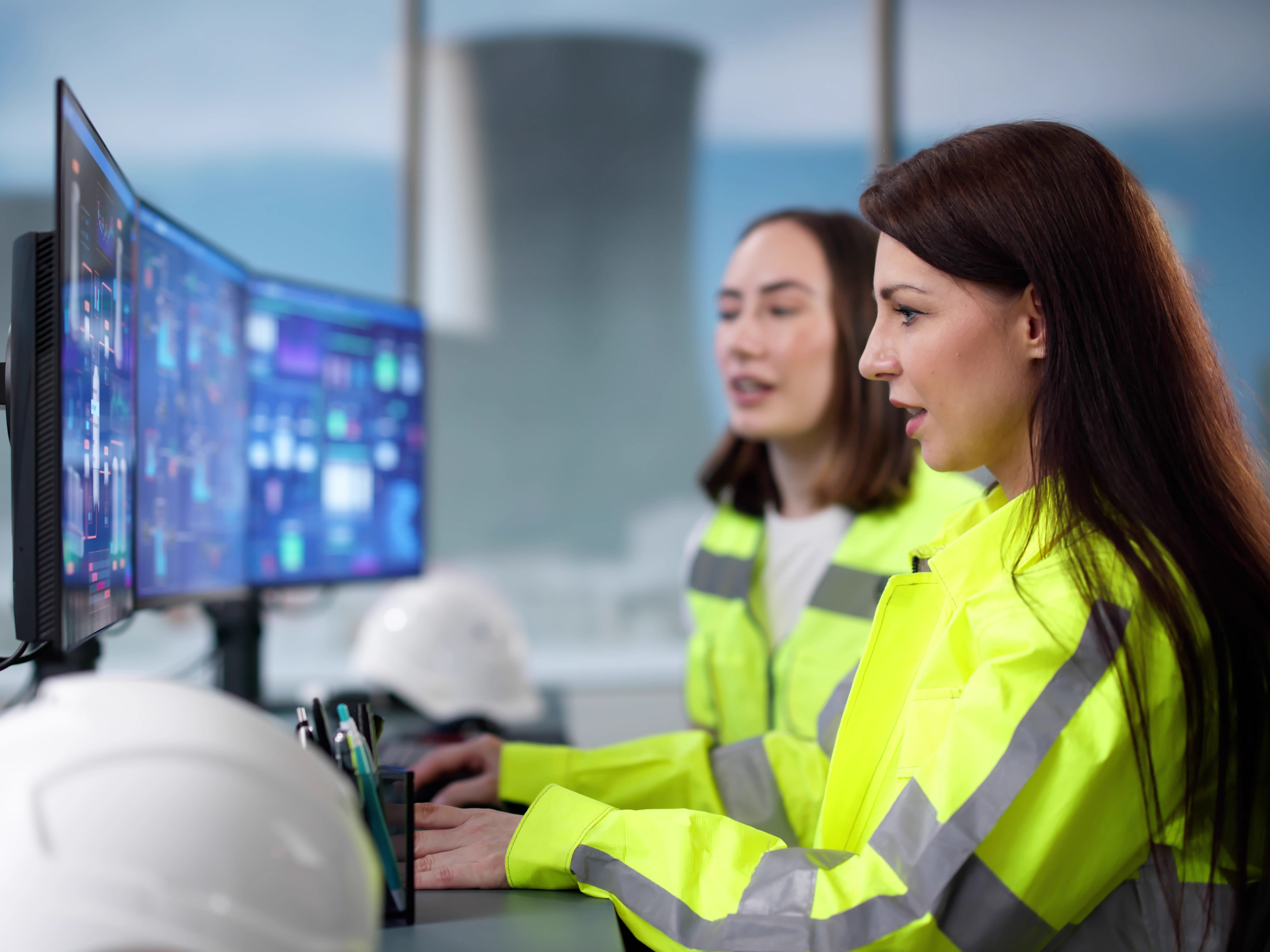 Workers looking at a screen